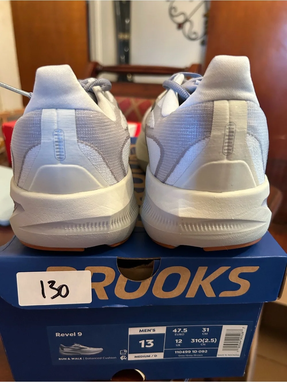 Men’s Brooks light gray and blue knit running shoes with gum outsole
